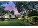 Charming single-story home with brick accents, mature trees and lush landscaping at 518 Stephanie Ct, Lake Mary, FL 32746