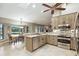 Bright kitchen with granite countertops and stainless steel appliances overlooking the breakfast area at 518 Stephanie Ct, Lake Mary, FL 32746
