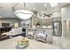 Open-concept kitchen featuring stainless appliances, an island with seating, and views of the living space at 518 Stephanie Ct, Lake Mary, FL 32746