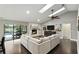 Bright living room featuring a fireplace, skylights, ceiling fan, and access to an outdoor pool and patio at 518 Stephanie Ct, Lake Mary, FL 32746