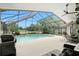 Spacious screened-in pool area with dining and lounge areas, perfect for entertaining at 518 Stephanie Ct, Lake Mary, FL 32746