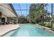 Inviting screened-in pool area with covered patio and views of the surrounding landscape at 518 Stephanie Ct, Lake Mary, FL 32746