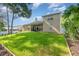 Lush backyard with a large tree, a well-kept lawn, providing ample space for recreation and outdoor activities at 538 Majestic Oak Dr, Apopka, FL 32712