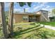 Spacious backyard with a well-maintained lawn and covered patio at 538 Majestic Oak Dr, Apopka, FL 32712