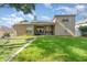 Expansive backyard featuring a well-maintained lawn, and a patio perfect for outdoor relaxation and entertaining at 538 Majestic Oak Dr, Apopka, FL 32712