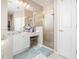Bathroom featuring a glass enclosed shower, a vanity, and neutral finishes creating a functional and stylish design at 538 Majestic Oak Dr, Apopka, FL 32712