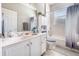 Bright bathroom with white cabinets, a shower-tub combo, and neutral finishes for a clean and fresh appearance at 538 Majestic Oak Dr, Apopka, FL 32712