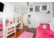 Bright bedroom with ample closet space, desk, and a pink area rug at 538 Majestic Oak Dr, Apopka, FL 32712