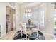 Charming breakfast nook with bright, natural light filtering through white curtains, creating a cozy dining space at 538 Majestic Oak Dr, Apopka, FL 32712