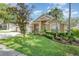 Inviting exterior view with lush green lawn and mature landscaping highlighting this beautiful home's curb appeal at 538 Majestic Oak Dr, Apopka, FL 32712