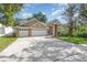 Well-maintained home boasting a three-car garage and landscaped front yard, perfect for curb appeal at 538 Majestic Oak Dr, Apopka, FL 32712