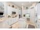 Spacious kitchen boasts white cabinets, stainless steel appliances, and ample counter space for cooking and entertaining at 538 Majestic Oak Dr, Apopka, FL 32712