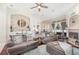 Spacious living room with modern décor, inviting sofas, and a lovely fireplace, perfect for relaxation at 538 Majestic Oak Dr, Apopka, FL 32712