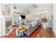 Cozy living room features stylish furnishings, hardwood floors, and a charming fireplace at 538 Majestic Oak Dr, Apopka, FL 32712