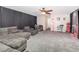 Cozy living room with media equipment, soft carpet, and ample seating at 538 Majestic Oak Dr, Apopka, FL 32712