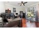 Inviting office space with large window, dark wood furniture, and a dedicated workout area at 538 Majestic Oak Dr, Apopka, FL 32712