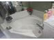 Bathroom featuring a corner bathtub with tile surround and modern fixtures at 679 Midori St, Orlando, FL 32811