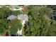 Aerial view of house with mature trees and a long driveway at 7219 Hunterdon Dr, Orlando, FL 32835