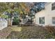 Backyard with mature trees and an old trampoline needs some TLC at 7219 Hunterdon Dr, Orlando, FL 32835