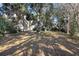 Backyard features mature trees that offer shade for hot days at 7219 Hunterdon Dr, Orlando, FL 32835