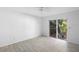 Spacious bedroom with tile flooring, and access to the backyard at 7219 Hunterdon Dr, Orlando, FL 32835