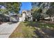 Inviting two-story home featuring a two-car garage and well-maintained lawn at 7219 Hunterdon Dr, Orlando, FL 32835