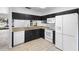 Well-lit kitchen with granite countertops, dark cabinetry, and stainless steel appliances at 7219 Hunterdon Dr, Orlando, FL 32835