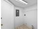 Bright laundry room features tile floors and a wire rack for storage at 7219 Hunterdon Dr, Orlando, FL 32835