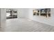 Spacious living room featuring a large window for natural light and modern flooring at 7219 Hunterdon Dr, Orlando, FL 32835