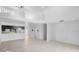 Spacious living area open to kitchen with white cabinets, new flooring, and an abundance of natural light at 7219 Hunterdon Dr, Orlando, FL 32835