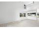 Open-concept living area with lots of natural light with view to the kitchen at 7219 Hunterdon Dr, Orlando, FL 32835