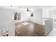 Second floor landing features hardwood flooring and a window at 7219 Hunterdon Dr, Orlando, FL 32835