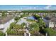 Aerial view of the neighborhood, showcasing lush landscaping, a playground, and a basketball court at 7456 Marker Ave, Kissimmee, FL 34747