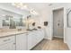 Modern bathroom featuring a double vanity, granite countertops and a separate shower at 7456 Marker Ave, Kissimmee, FL 34747