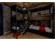 Whimsical themed bedroom with bunk beds, 'book' steps, and stone-look wallpaper at 7456 Marker Ave, Kissimmee, FL 34747