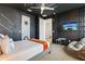 Star Wars themed bedroom with painted walls, lightsaber decor, TV, bean bag chair, and queen sized bed at 7456 Marker Ave, Kissimmee, FL 34747