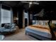 Star Wars themed bedroom with painted walls, ceiling fan, bean bag chair, and queen sized bed at 7456 Marker Ave, Kissimmee, FL 34747