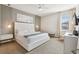 Modern bedroom with gray accent wall, textured wall, and ceiling fan at 7456 Marker Ave, Kissimmee, FL 34747