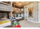 Custom bunk beds in themed bedroom with 'book' steps, closet, and decor at 7456 Marker Ave, Kissimmee, FL 34747