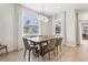 Well-lit dining room featuring a wooden table with seating for six at 7456 Marker Ave, Kissimmee, FL 34747