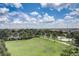 Lush green space with palm trees and walking paths, offering a serene and picturesque outdoor environment at 7456 Marker Ave, Kissimmee, FL 34747