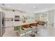 Bright, modern kitchen features a large island with seating and stainless steel appliances at 7456 Marker Ave, Kissimmee, FL 34747