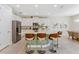 Stylish kitchen with white cabinets, stainless steel appliances, and a granite countertop island at 7456 Marker Ave, Kissimmee, FL 34747