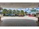 Welcoming entrance showcasing tricycle rentals with well-maintained landscaping, offering a convenient and Gathering-friendly feature at 7456 Marker Ave, Kissimmee, FL 34747