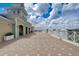Expansive rooftop patio with elegant white railings, offering panoramic views and a sophisticated outdoor space at 7456 Marker Ave, Kissimmee, FL 34747