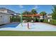 Community splash pad featuring water features and shaded seating, perfect for Gathering fun at 7456 Marker Ave, Kissimmee, FL 34747