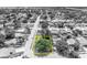 Bird's-eye view showcasing property boundaries and surrounding neighborhood with mature trees at 7601 Aviano Ave, Orlando, FL 32819