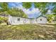 Spacious backyard featuring well-kept lawn and a detached garage offering extra storage at 7601 Aviano Ave, Orlando, FL 32819