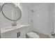 Clean bathroom features a tiled shower and modern vanity at 7601 Aviano Ave, Orlando, FL 32819