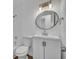 Bright bathroom featuring a modern vanity and tiled shower-tub combo at 7601 Aviano Ave, Orlando, FL 32819